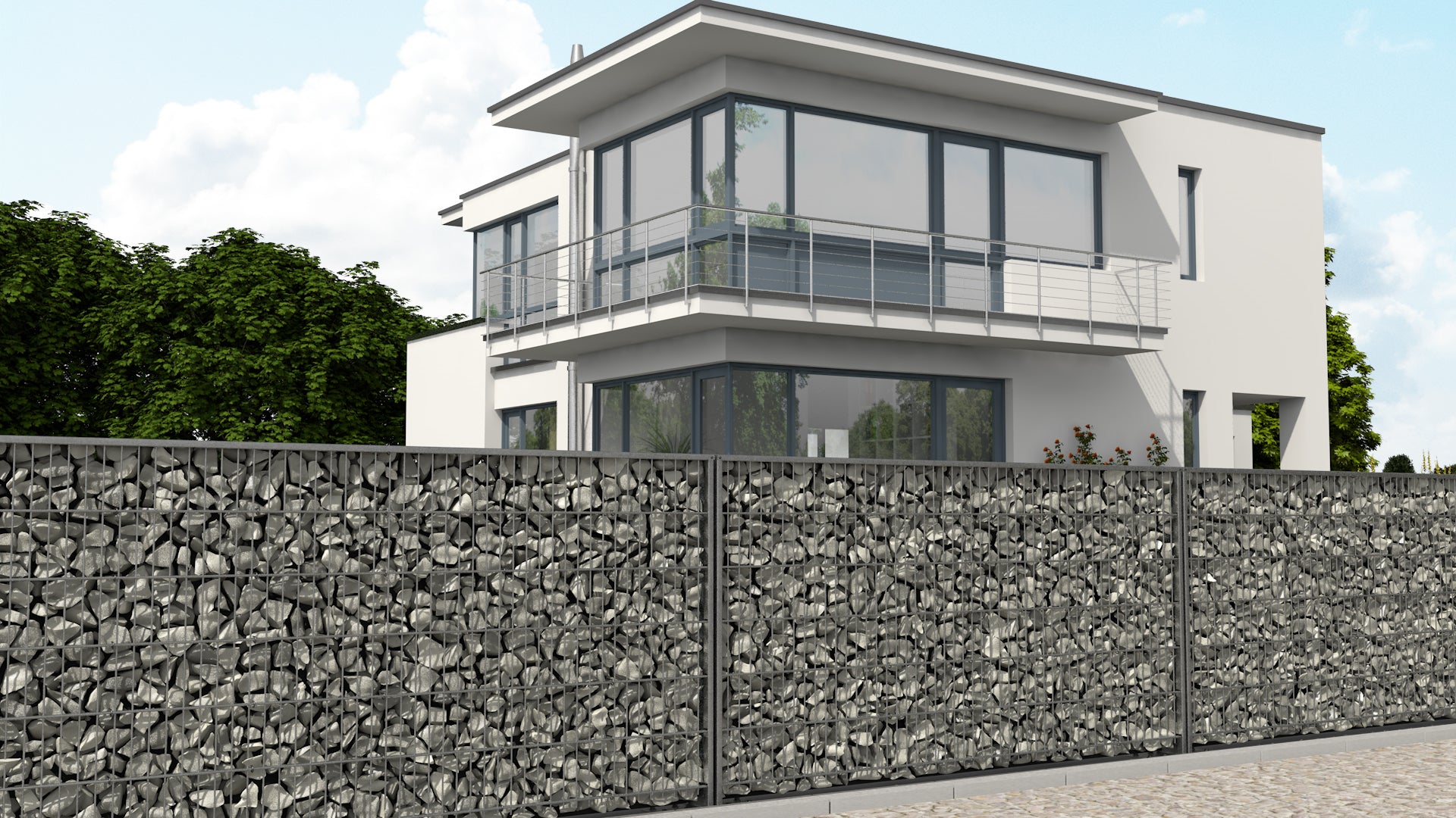 Gabionenzaun aus Metall und Steinen als Zaunanlage vor modernem Haus – MY-Zaunsysteme
